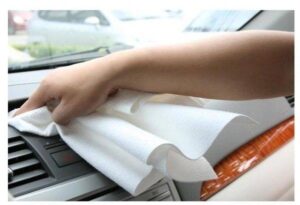 A person cleaning car Dashboard with Miracle Clean